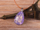 Real Flowers Pendant Necklace Encased in Resin that Glows in the Dark